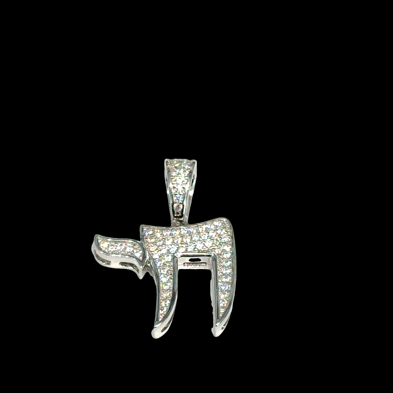 Hebrew Chai life symbol pendant in polished sterling silver with paved CZ detail on a black background, front overview. 
