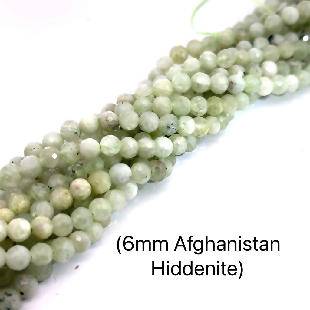 Hiddenite Gemstone Strand – 6mm Faceted Round Beads, 16" on white long overview