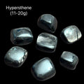 Hypersthene stone on a black background with the weight range indicated (11-20g), front view.