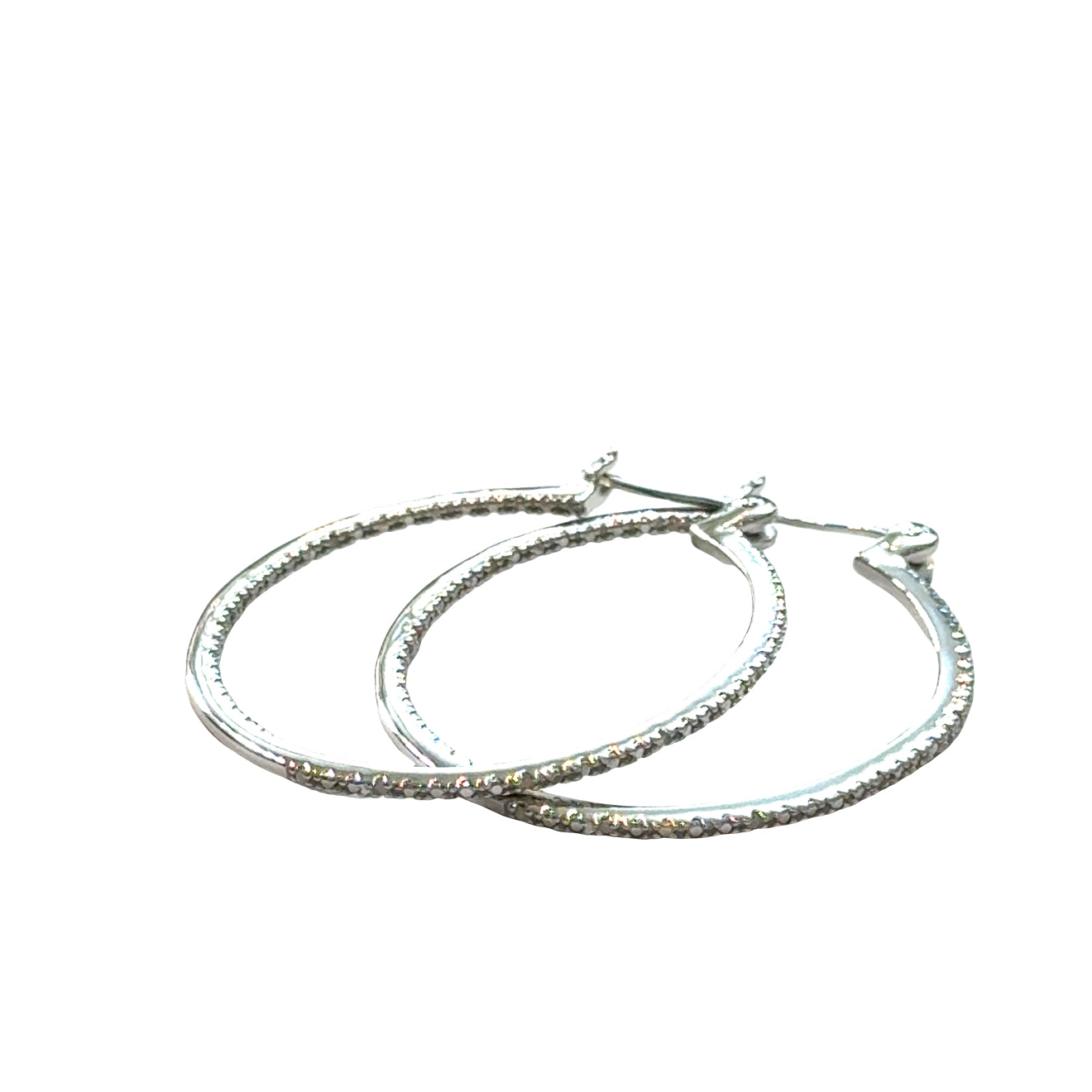 Inside-out diamond hoop earrings in sterling silver with snap-back closure showing sparkle, on a white background a close up front view. 