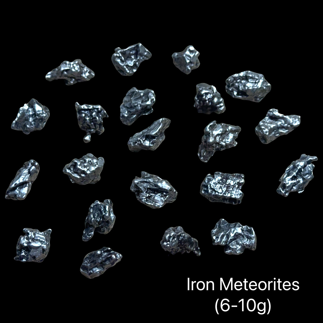 Iron meteorites on a black background with text indicating weight range (6-10g). front view.