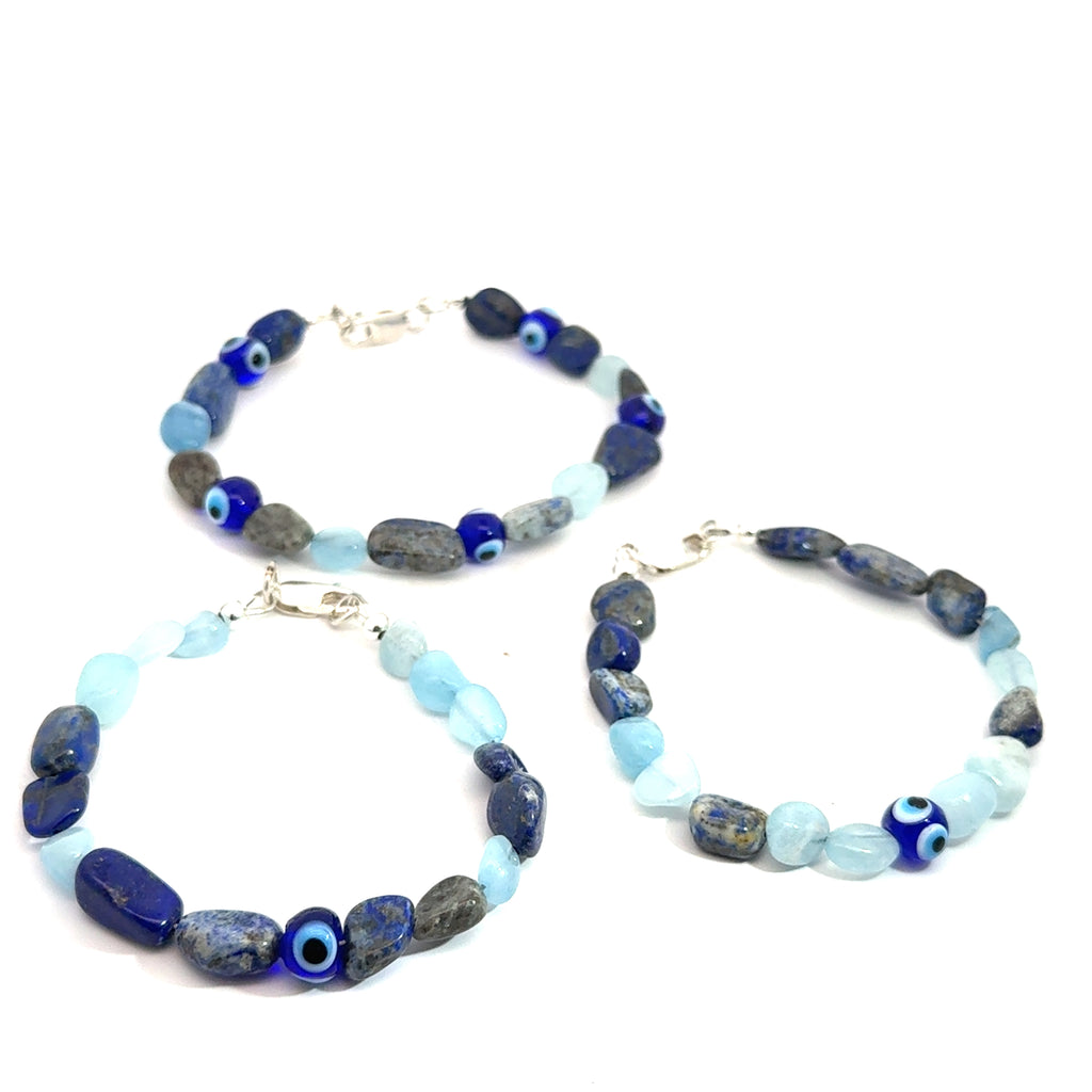 Lapis Lazuli, Aquamarine, Labradorite Gemstone with evil eye Bracelet grouping on white front view