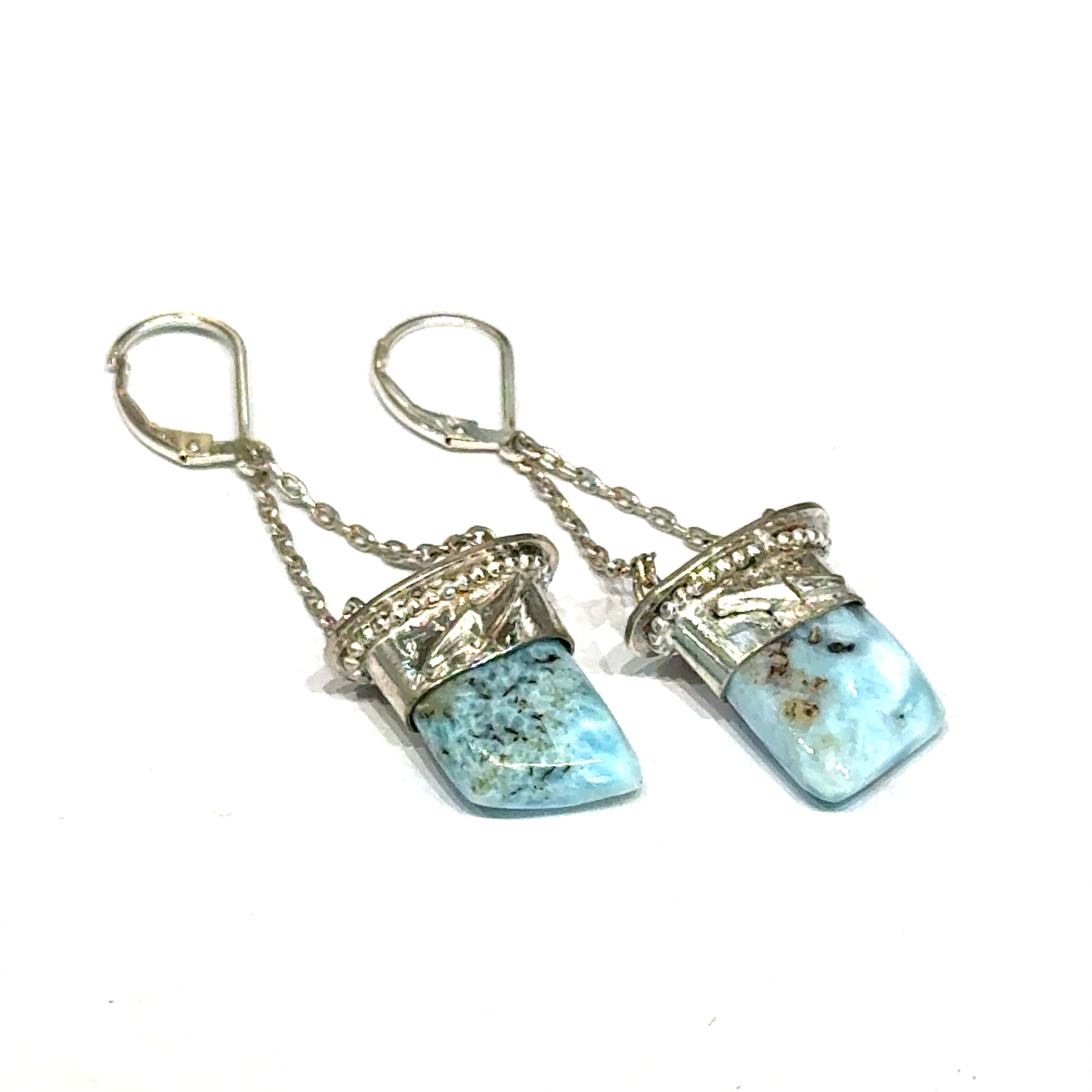 Larimar gemstone dangle earrings with lightning bolt sterling silver caps — handcrafted in Boston on a white background center front right angled close up overview. 