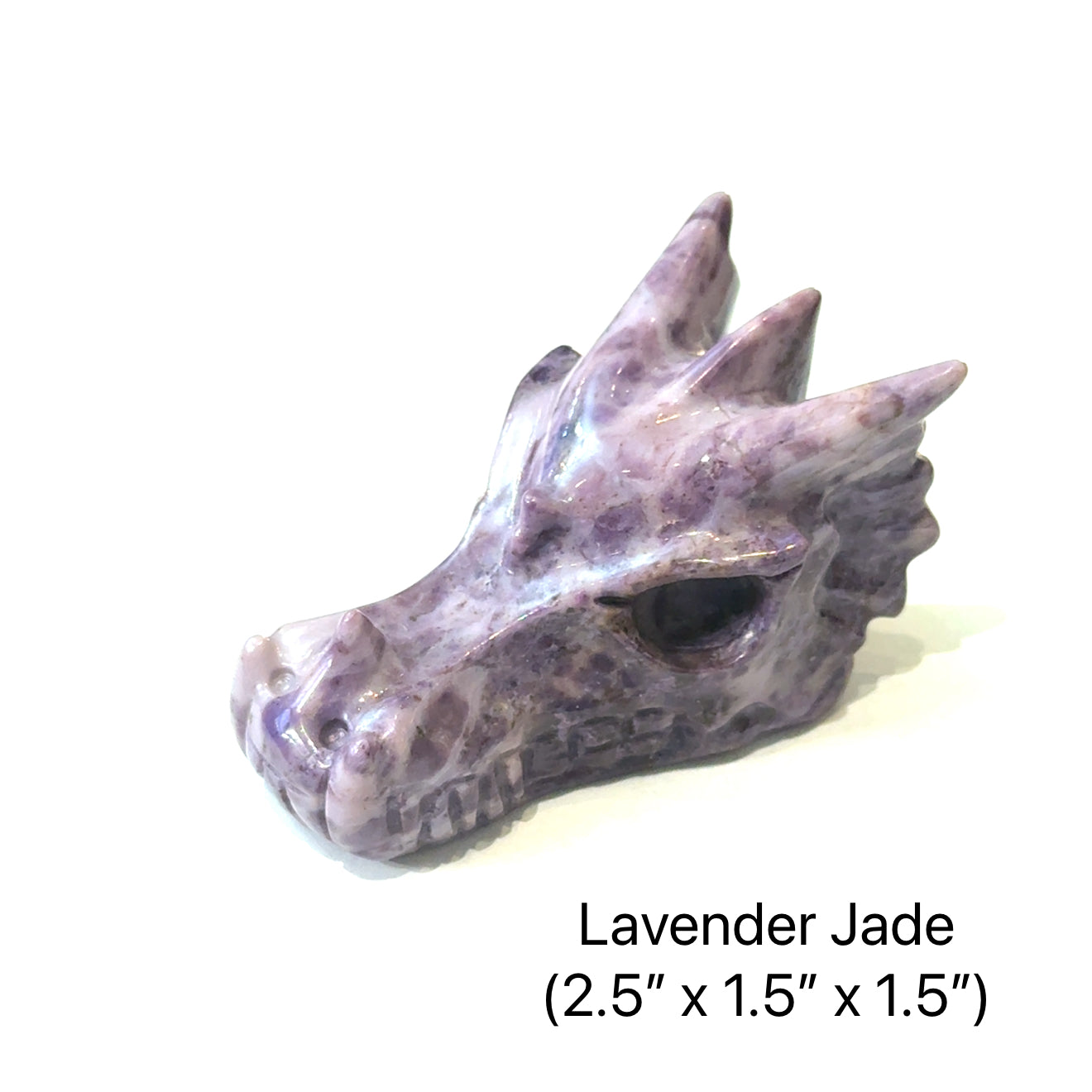 Lavender jade dragon head sculpture on a white background, with a slight right-side overview. 