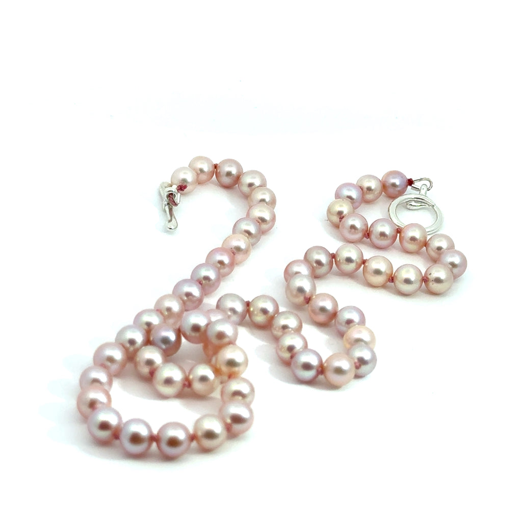 Light Pink Freshwater Pearl Necklace on white center  close up overview