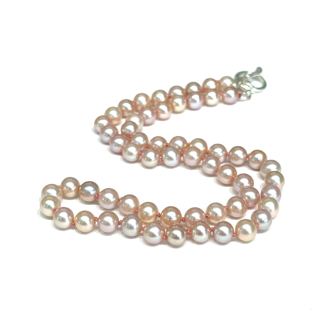 Light Pink Freshwater Pearl Necklace on white center diagonal close up overview