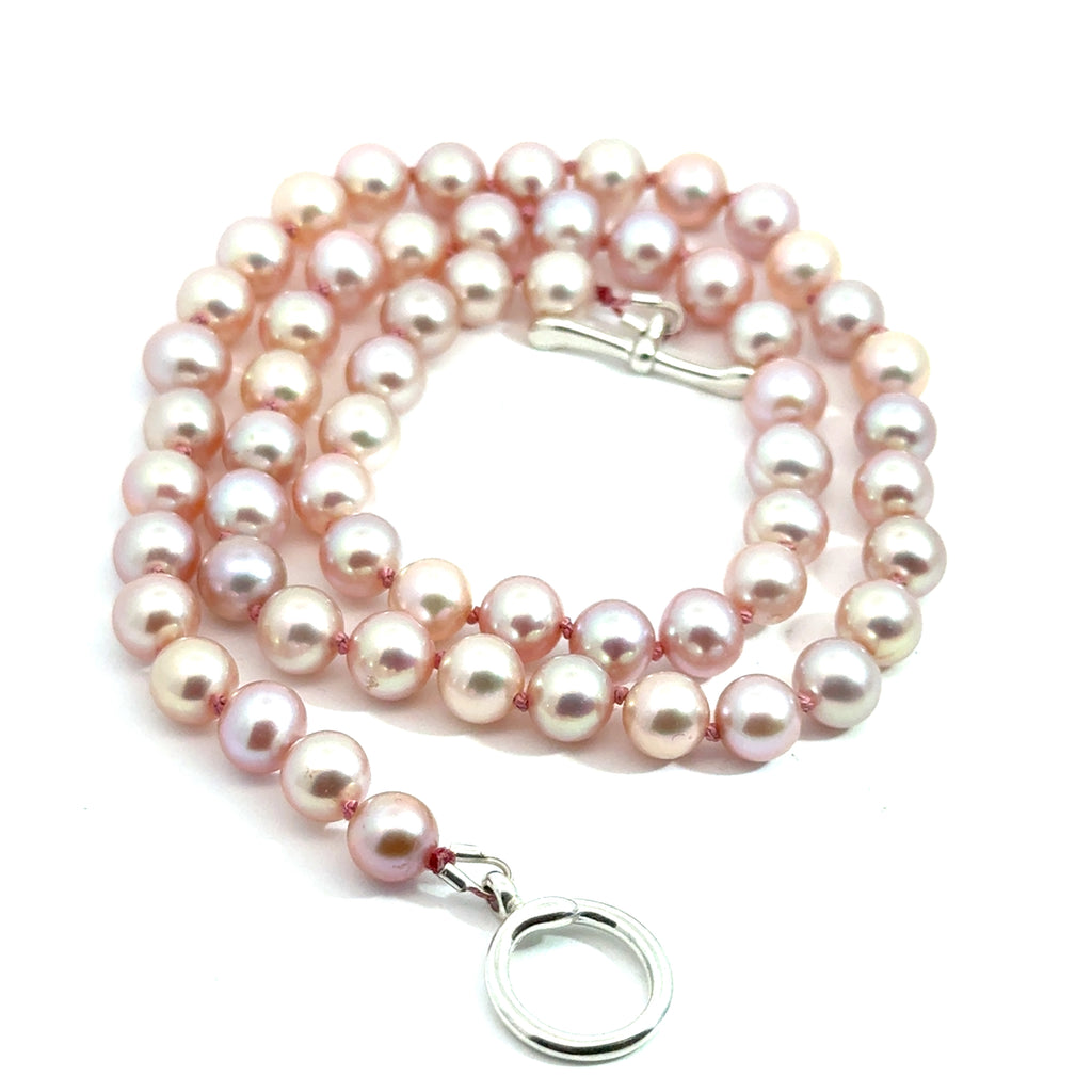 Light Pink Freshwater Pearl Necklace on white toggle close up overview