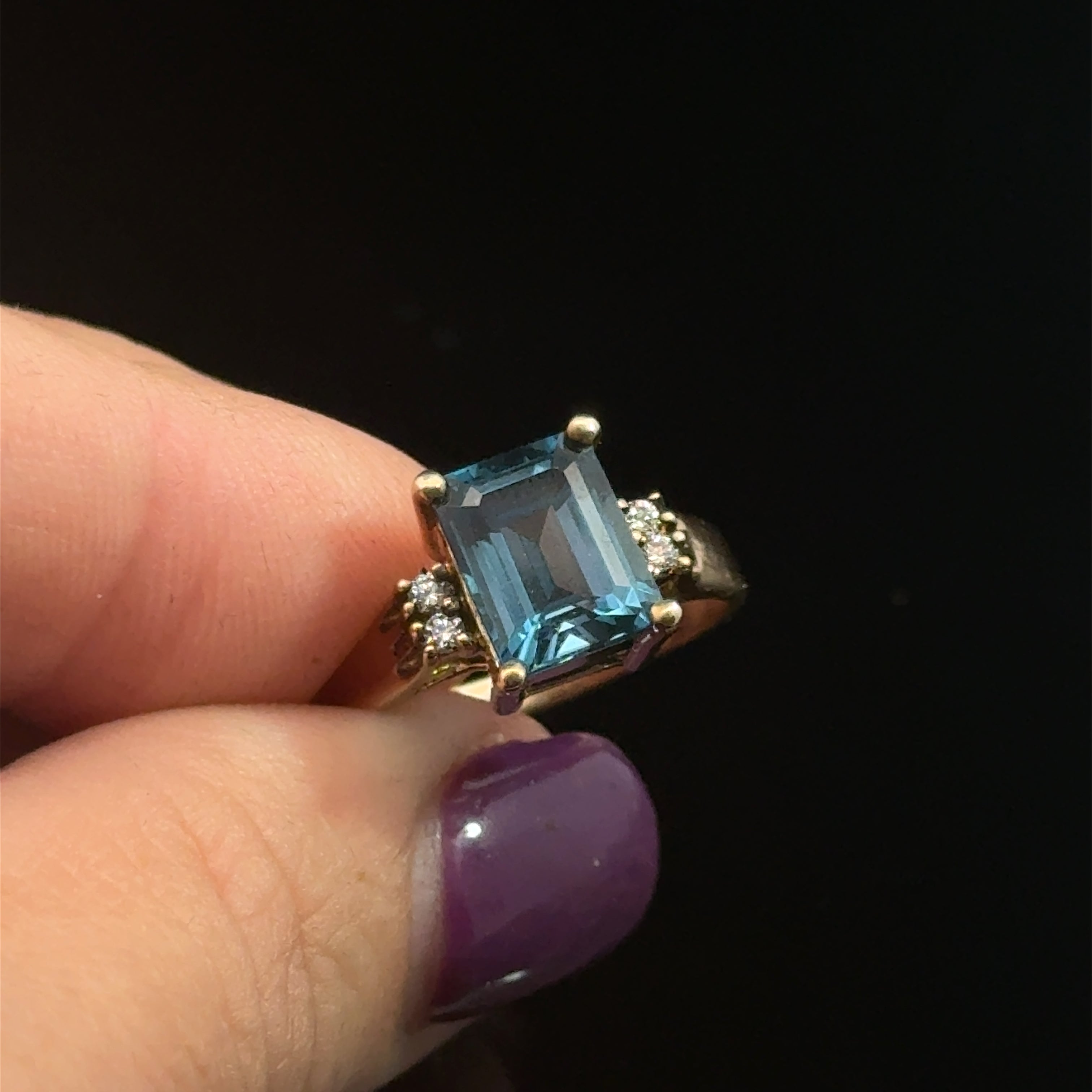London Blue Topaz & Diamond 14k Gold Ring on black close up front
