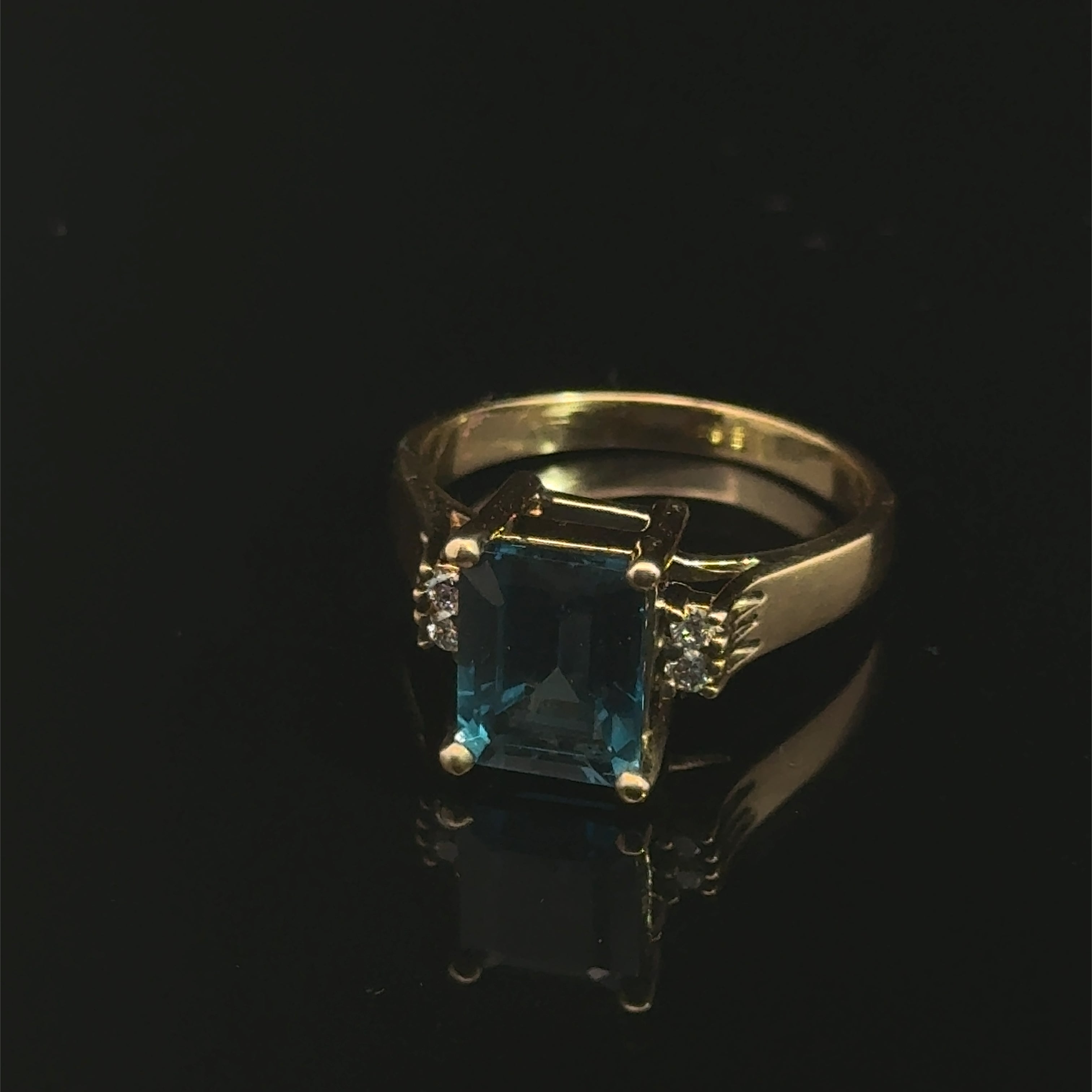 London Blue Topaz & Diamond 14k Gold Ring on black up front