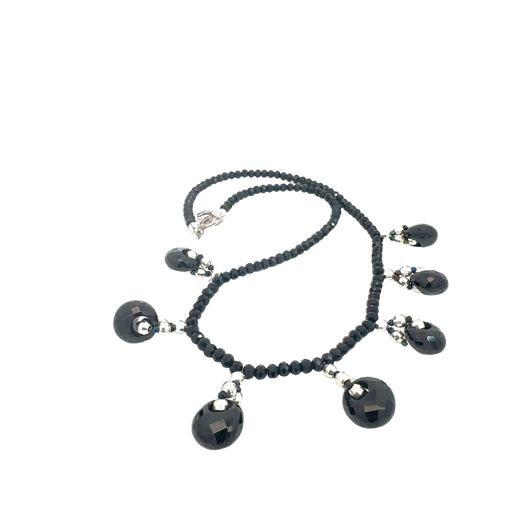 Luxury gemstone necklace featuring Black Tourmaline and Black Spinel for protection and empowerment on white center overview