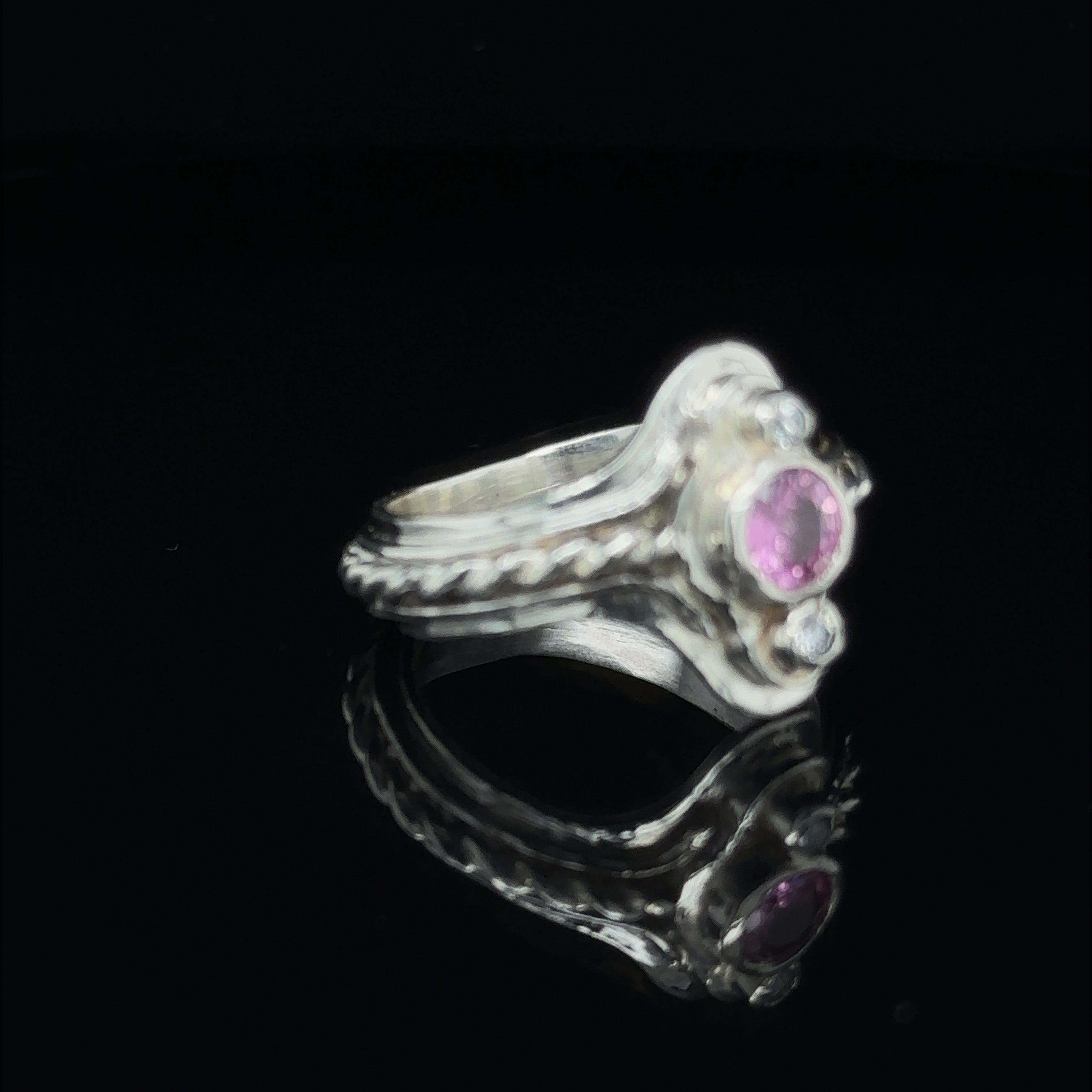 Luxury gemstone ring for women, perfect for gifting or personal wear on black right angle view