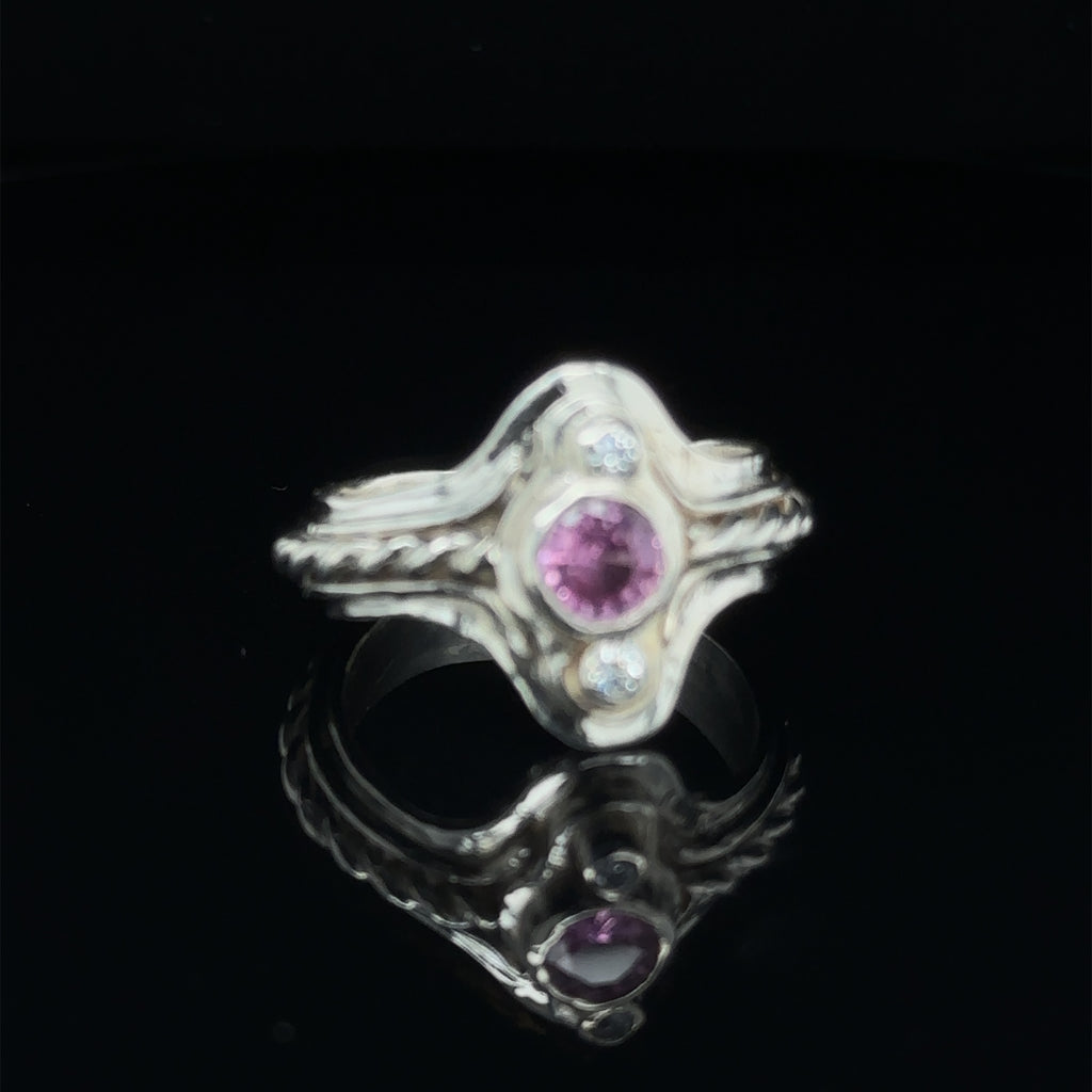 Luxury gemstone ring for women, perfect for gifting or personal wear on black slight right angle view