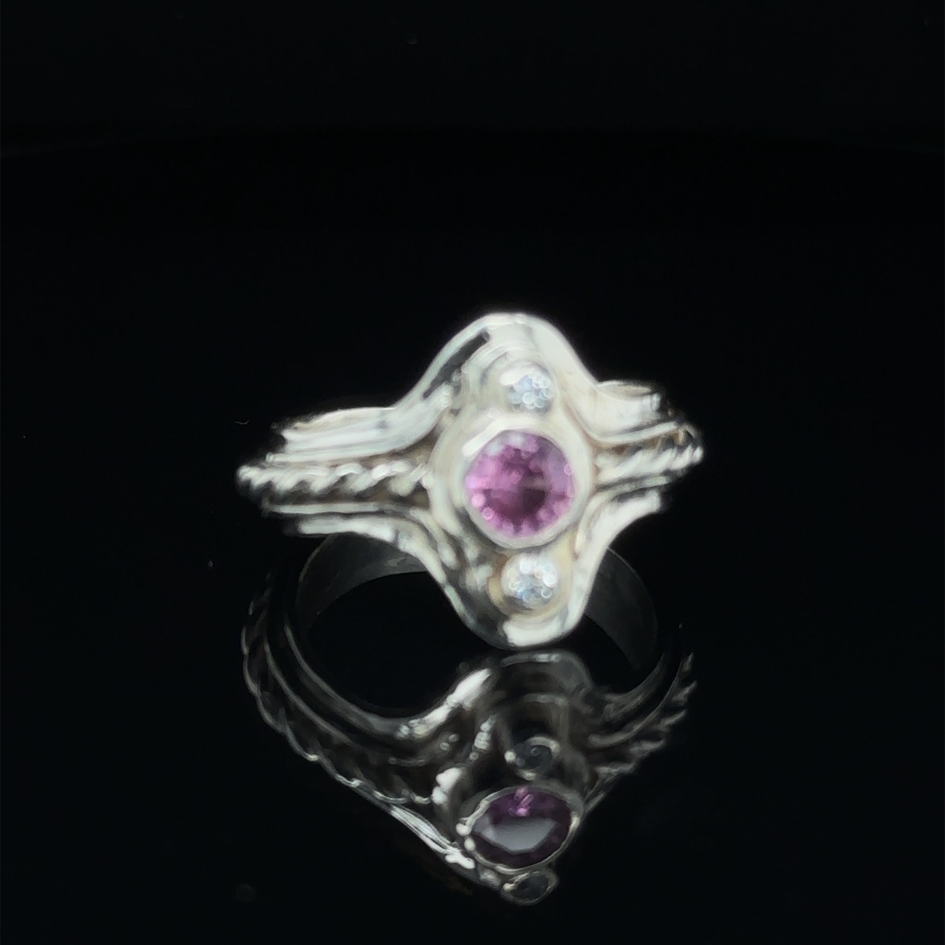 Luxury gemstone ring for women, perfect for gifting or personal wear on black slight right angle view