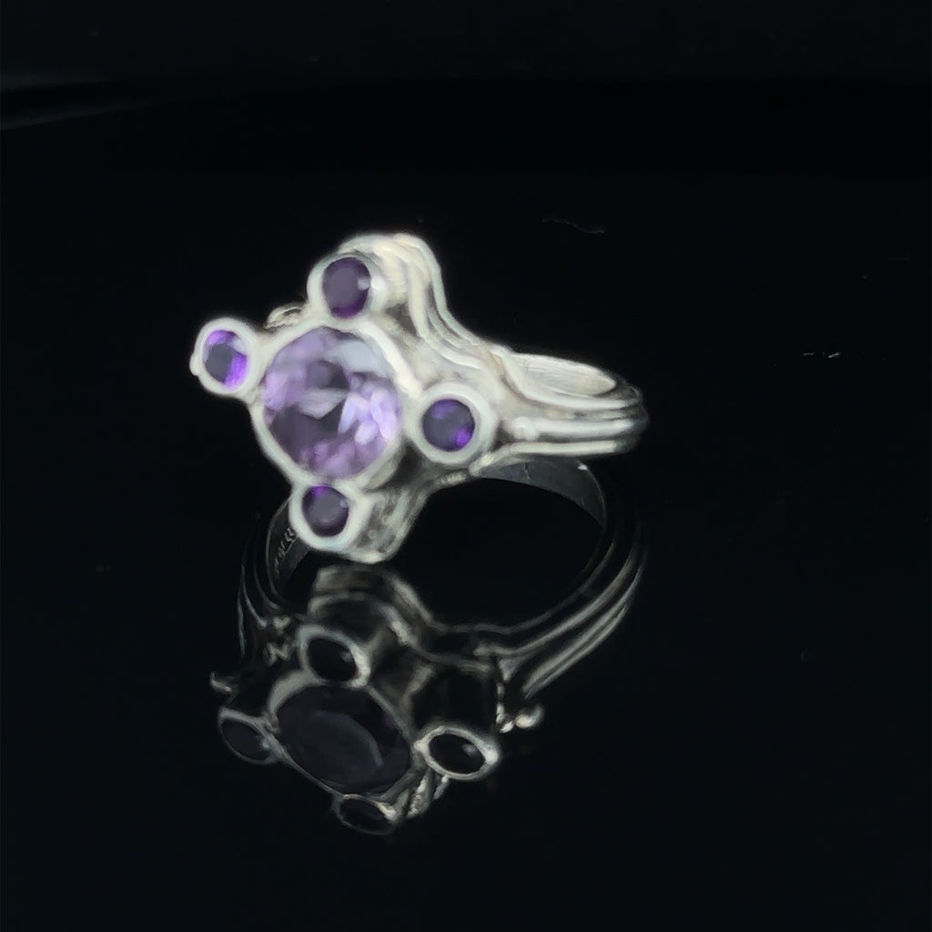Luxury gemstone ring perfect for gifting or personal wear, size 7 on black  slight left angle view