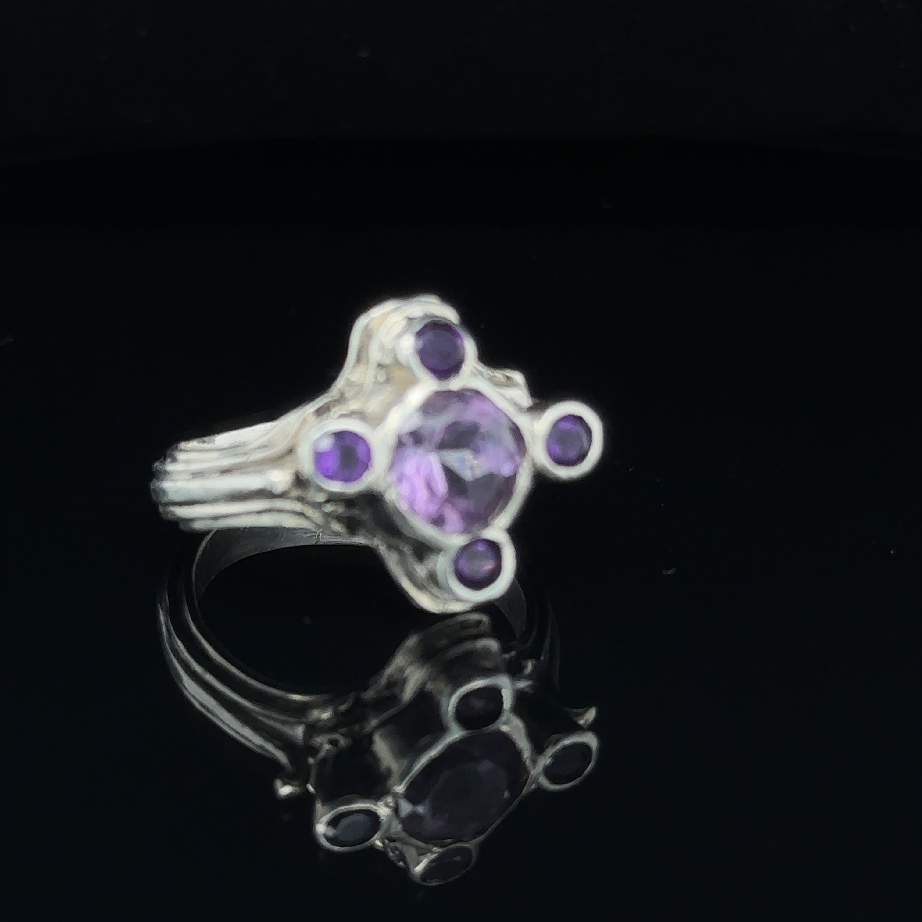 Luxury gemstone ring perfect for gifting or personal wear, size 7 on black slight right angle view
