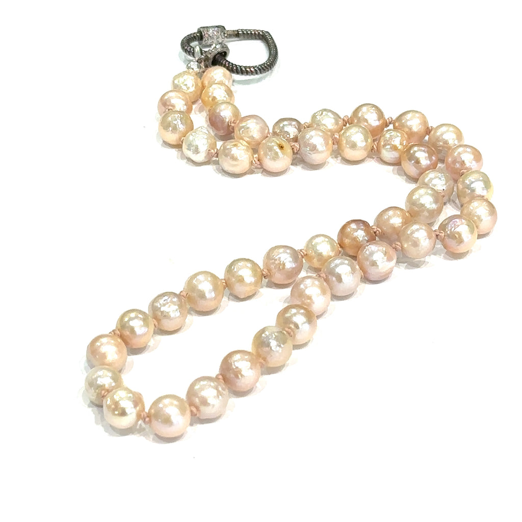 Luxury pearl necklace handmade in Boston jewelry shop on white long center overview