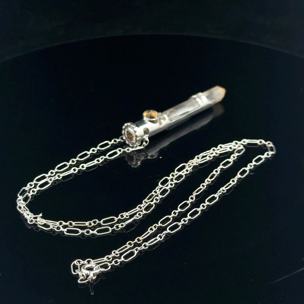 Mango Quartz Lightsaber Necklace in a Sterling Silver case with citrine gemstones to accent the pendant on a black background, back angle view. 
