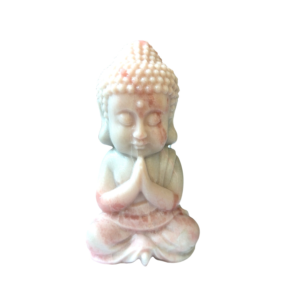 Medium pink opal Buddha statue with peachy-pink translucence and serene features, on a White background, in front view. 
