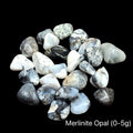 Merlinite Opal tumble Gemstone on a black background, (0-5g), front view.