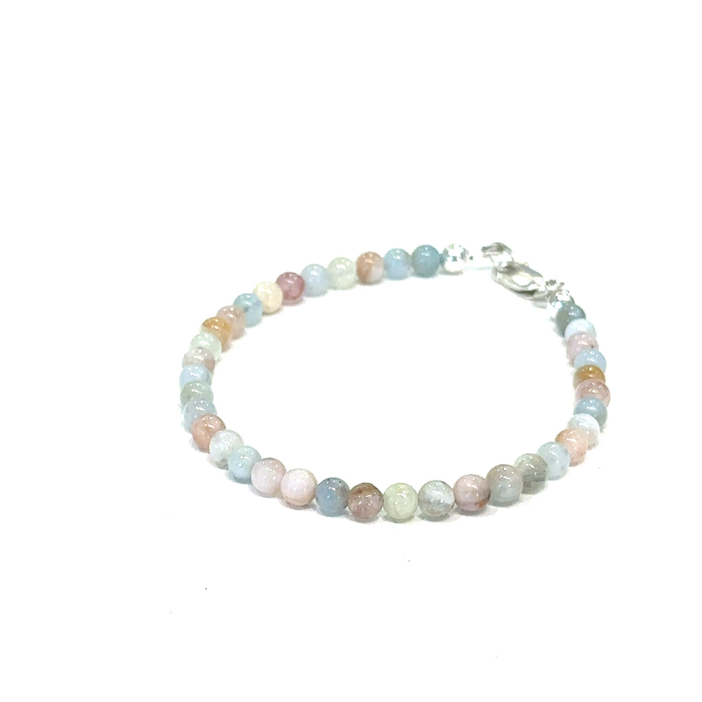 Morganite crystal bracelet for divine love and spiritual healing  on white top and front overview 