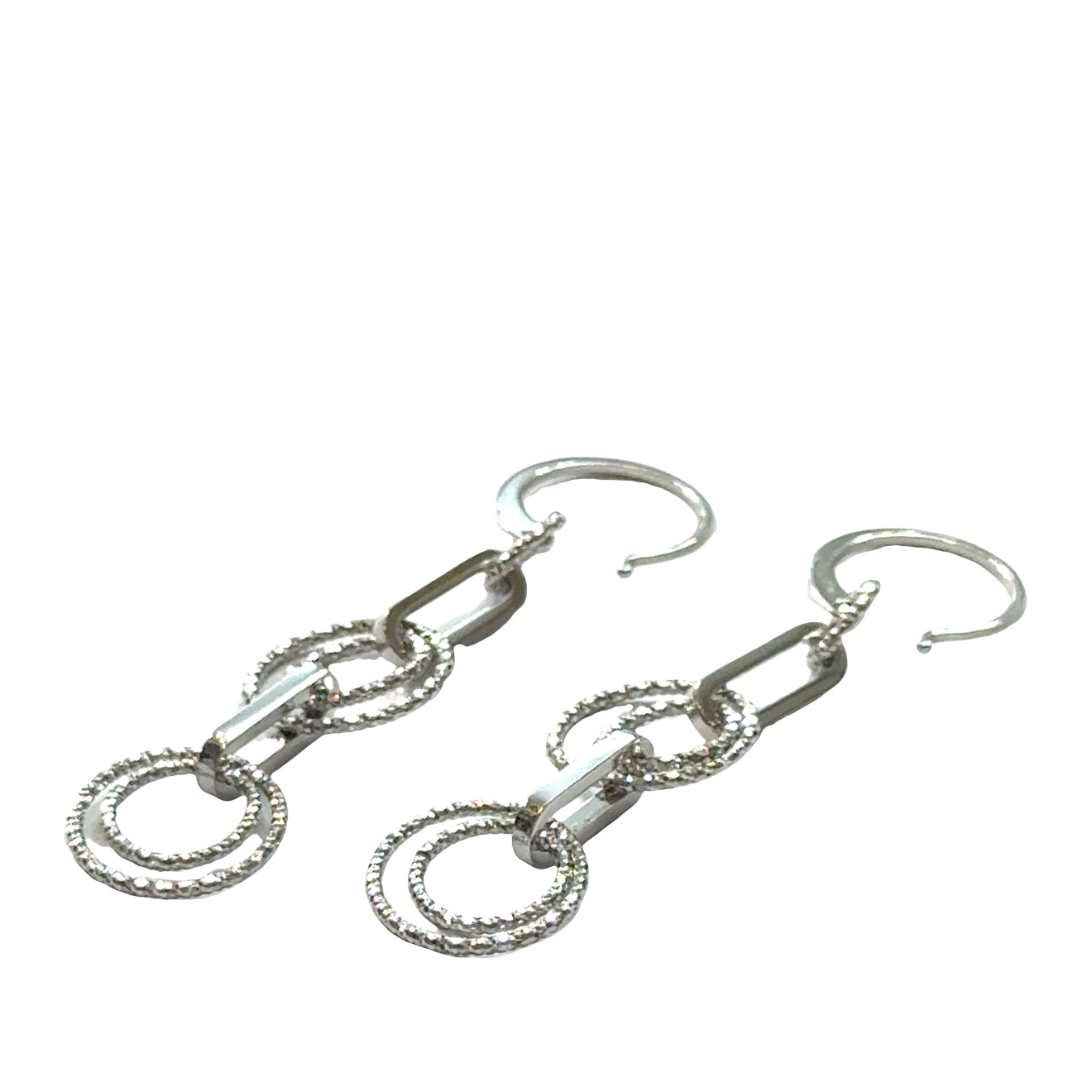 Multi-circle sterling silver dangle earrings with oval link showing sparkle and movement on a white background, front overview.