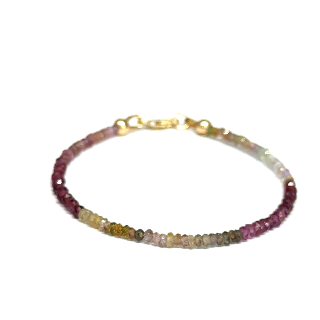 Multi-color brown sapphire gemstone bracelet with gold-filled  lobster claw on white background size 6.75'', front view.