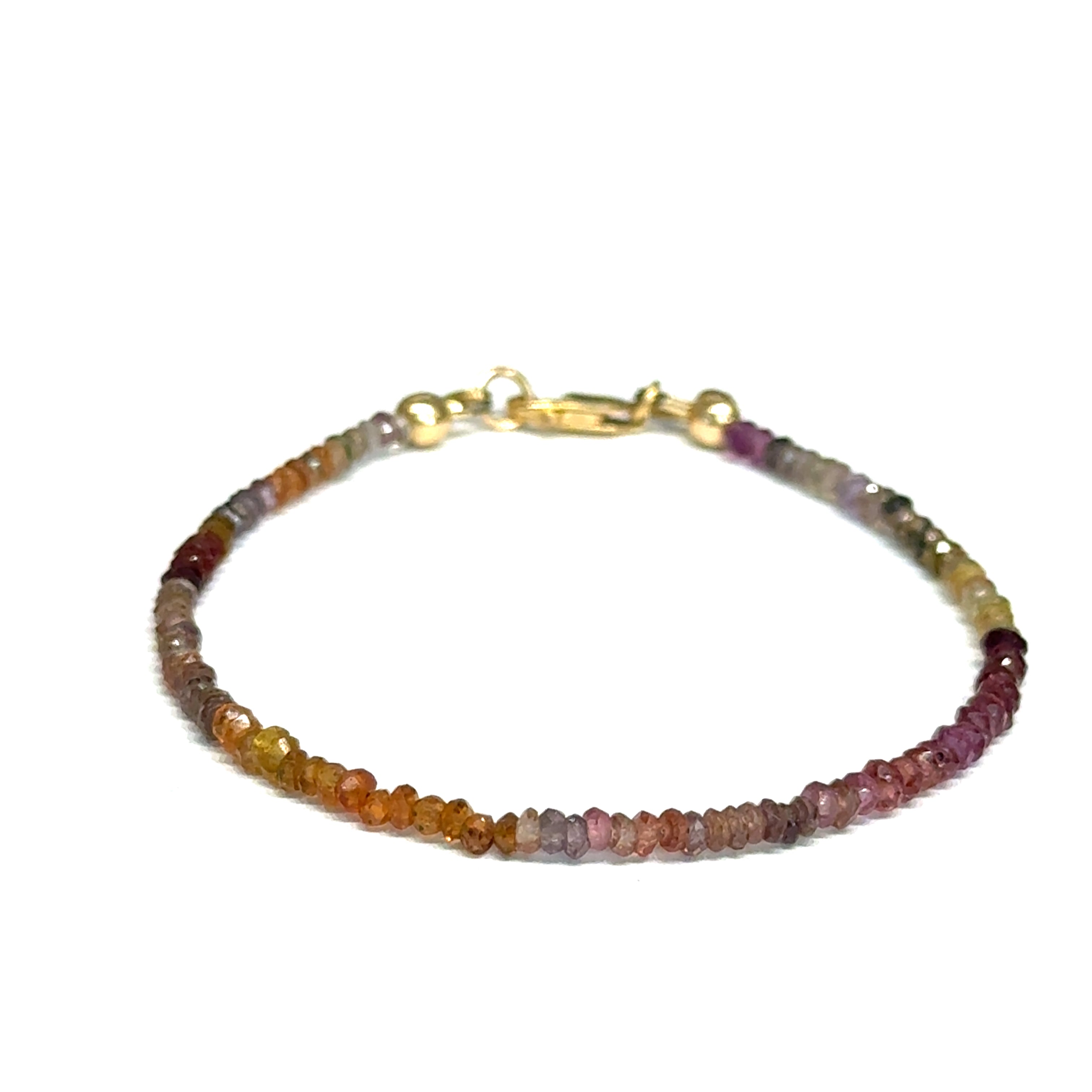 Multi-color brown sapphire gemstone bracelet with gold-filled  lobster claw on white background size 7'', front view.