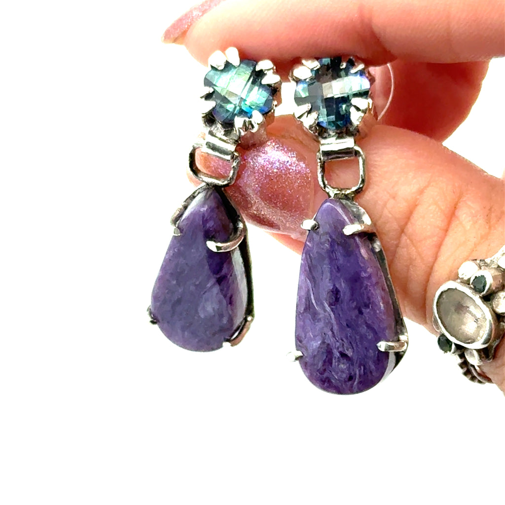 Mystic Topaz & Charoite on Sterling Silver earrings on white and in hands close up view