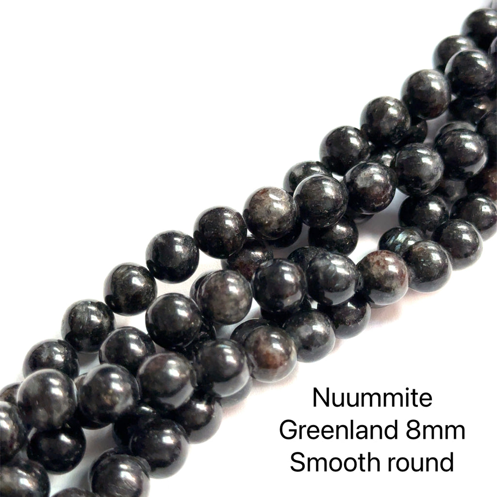 Nuummite Gemstone Strand 8mm smooth round on white close up view
