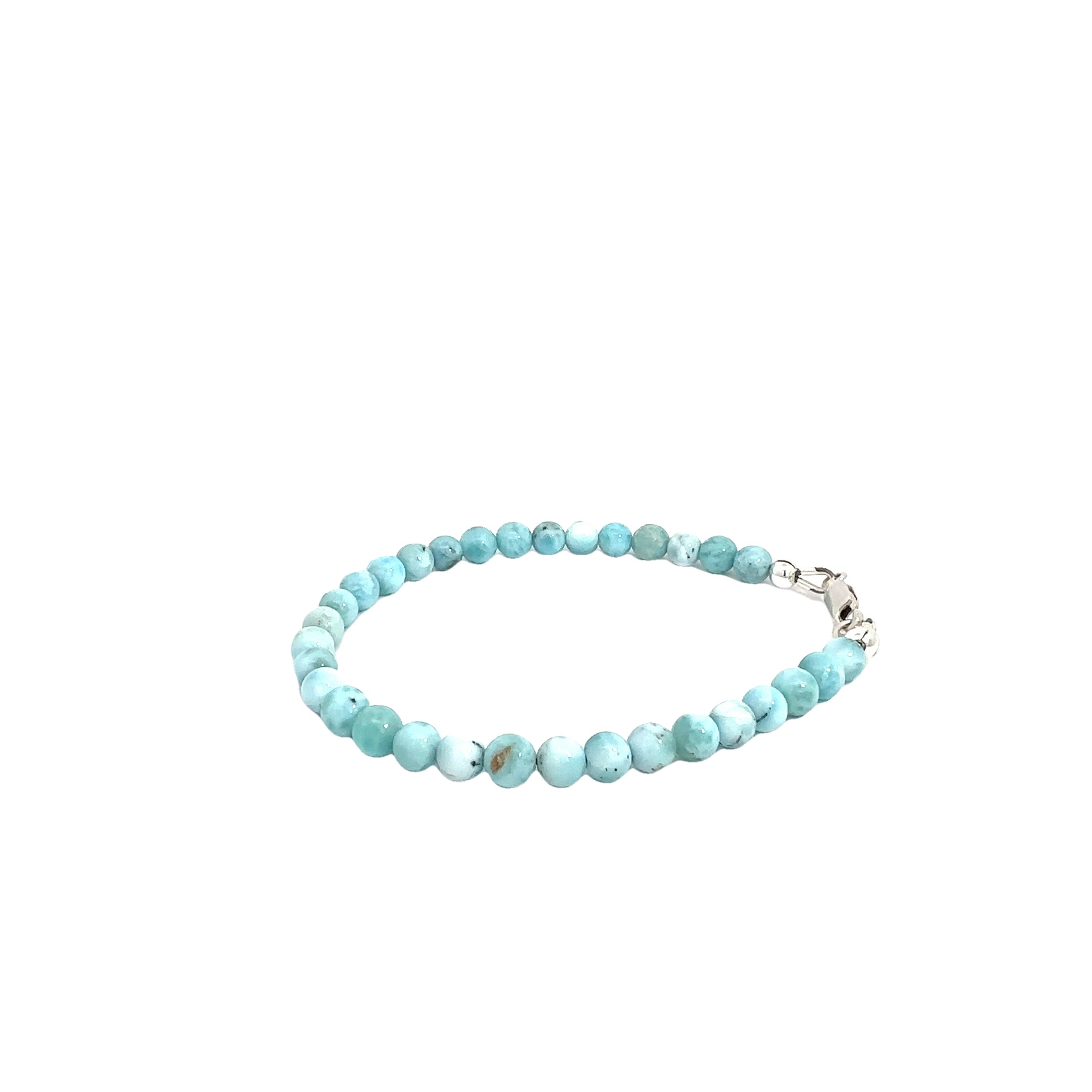 Ocean-blue Larimar beads strung on durable Beadalon wire with a sterling silver toggle on a white background front  left angle view. 