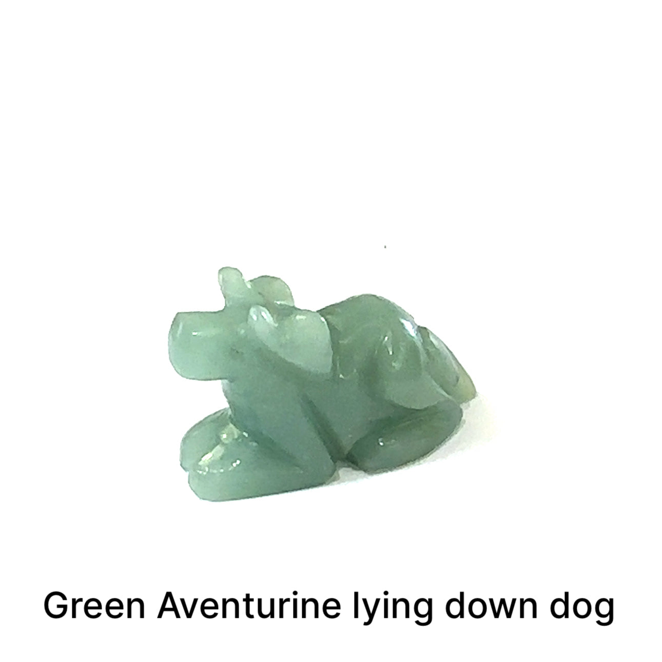 One Green Aventurine hound Dog gemstone carving lying down on white background, front view.
