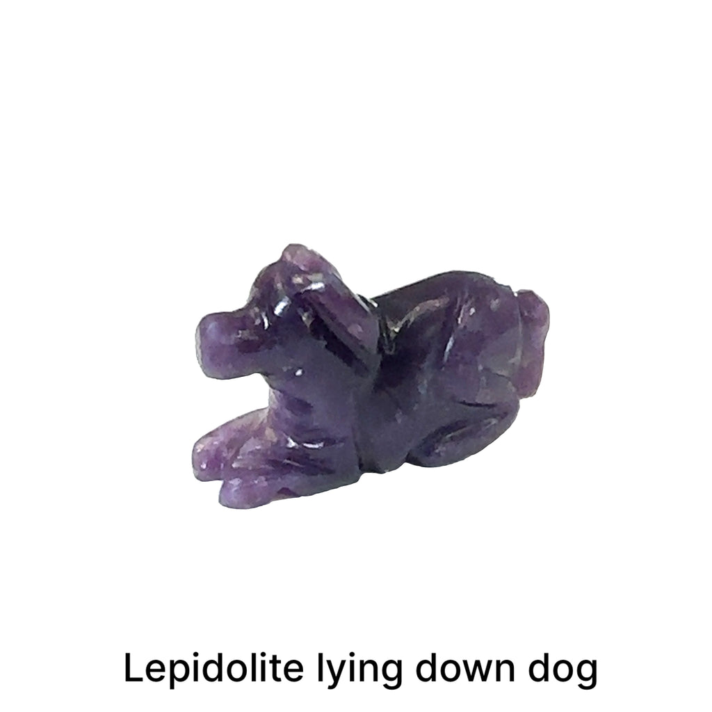 One Lepidolite hound Dog gemstone carving lying down on white background, front view.