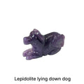 One Lepidolite hound Dog gemstone carving lying down on white background, front view.