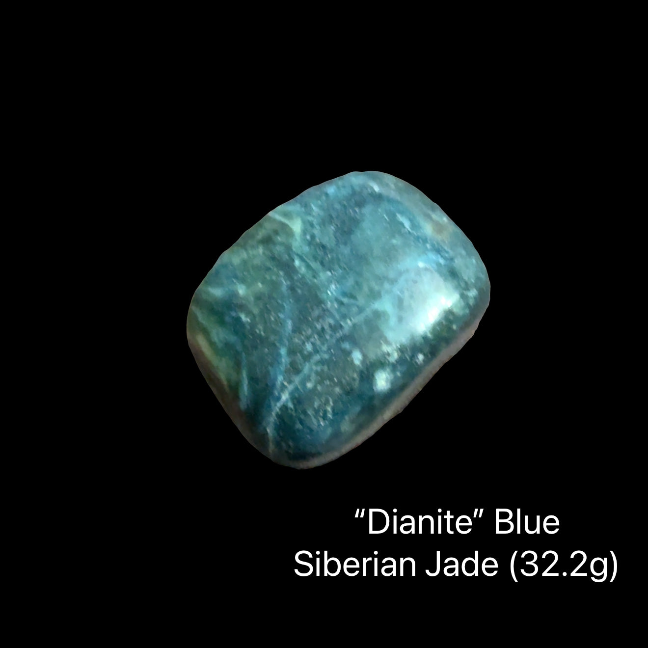 One blue stones labeled 'Dianite Blue Siberian Jade' on a black background, (32.2g), front view.