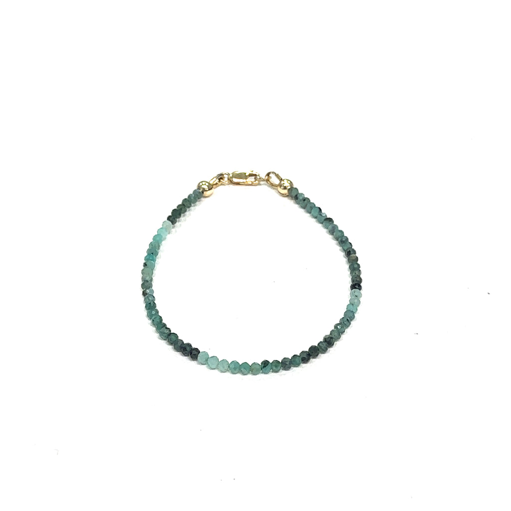 One‑of‑a‑kind Emerald gemstone jewelry perfect for holiday gifting on white front overview