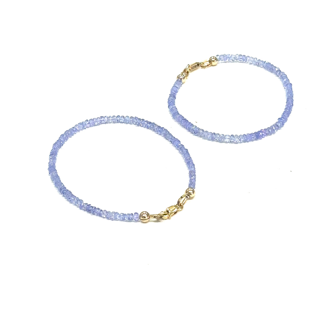 One‑of‑a‑kind Tanzanite gemstone jewelry perfect for holiday gifting grouping on white overview
