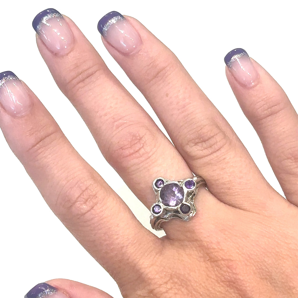 One‑of‑a‑kind artisan Amethyst ring handcrafted in sterling silver on white  and on middle finger for overview