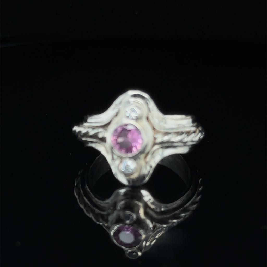 One‑of‑a‑kind artisan Pink Sapphire gemstone ring handcrafted in sterling silver on black slight angle view