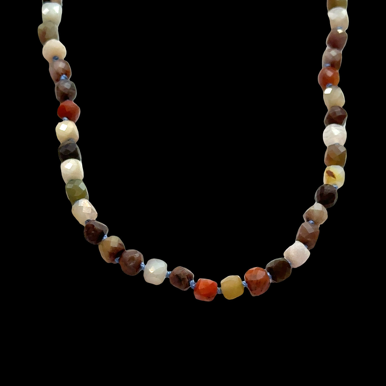 Petrified Wood gemstone necklace with 4mm faceted cube beads, silk-knotted, grounding transformation jewelry, 16-18 inches, on a black background, front overview.