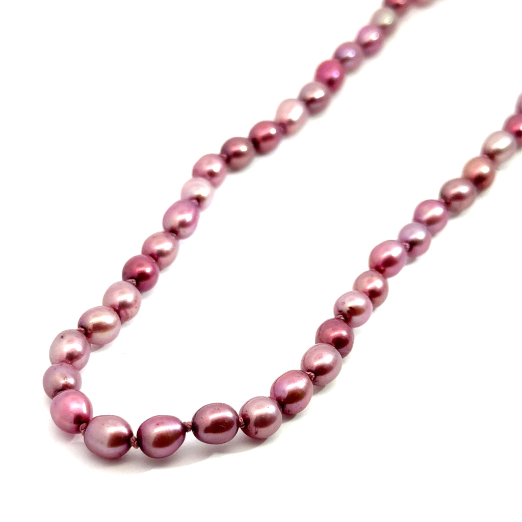 Pink Freshwater Pearl Necklace on white long and angled overview