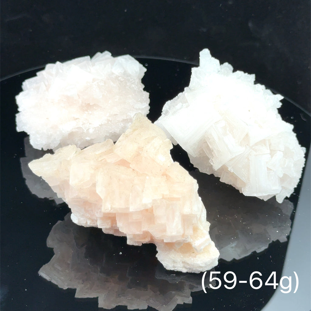 Pink Halite Raw Gemstone on black 59-64g front view