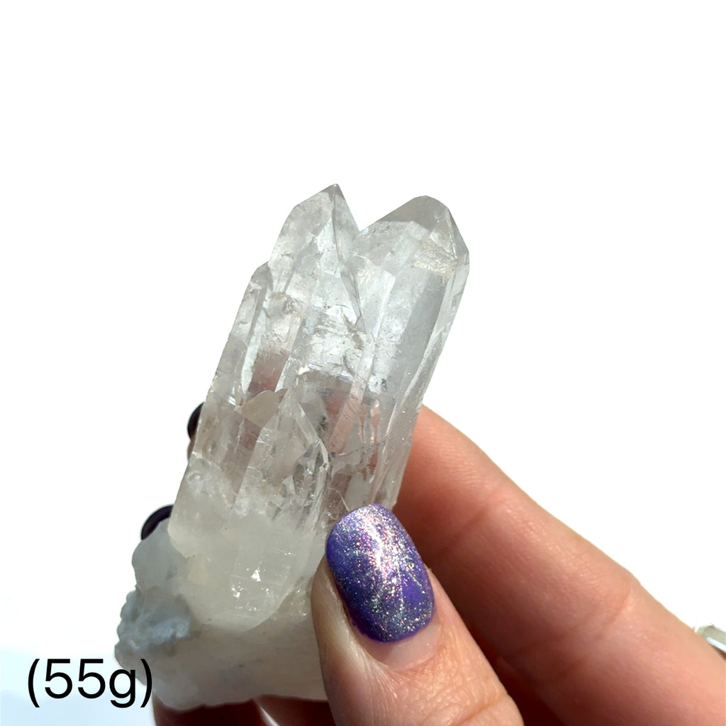 Pink Lemurian Quartz Gemstone 55g  on white in hand front view