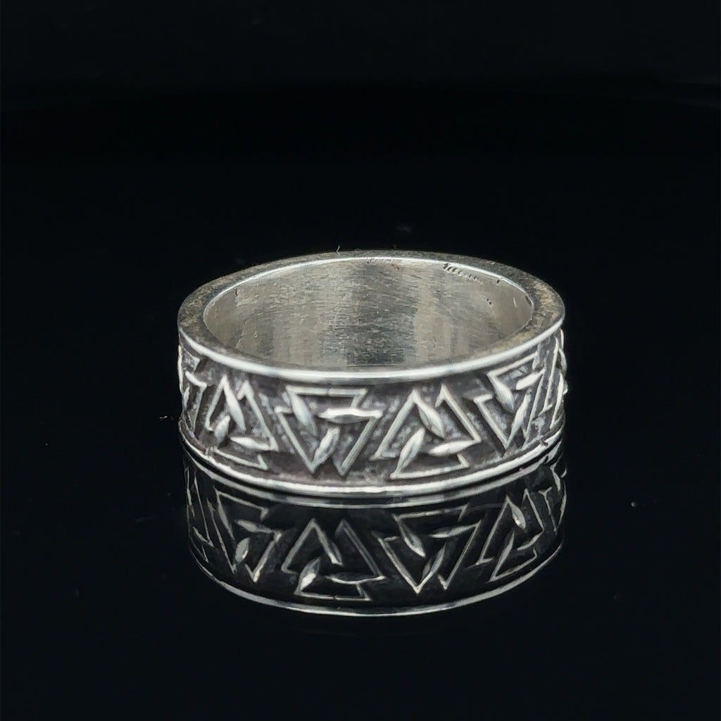 Polished sterling silver sacred shape ring for men’s fashion on black front view