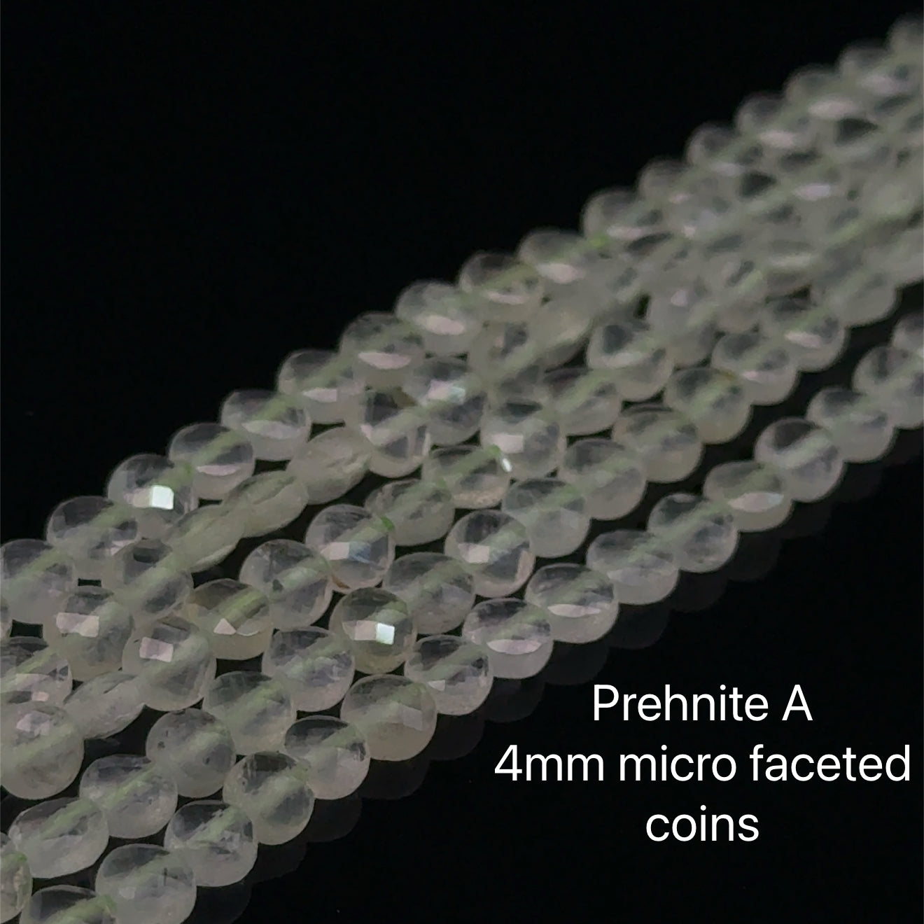 Prehnite A 4mm micro faceted coins gemstone on a white background, front overview. 