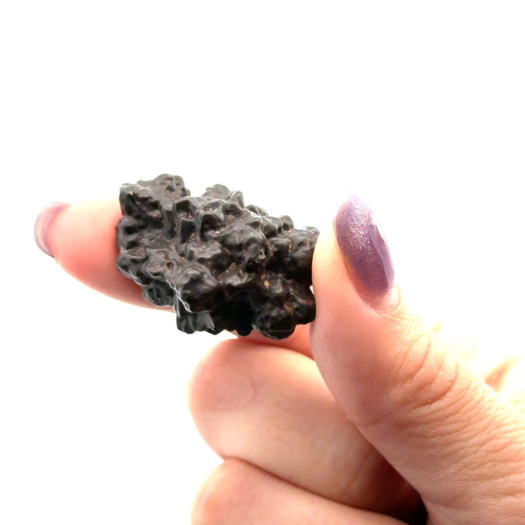 Prophecy Stone Gemstone on white in hand view