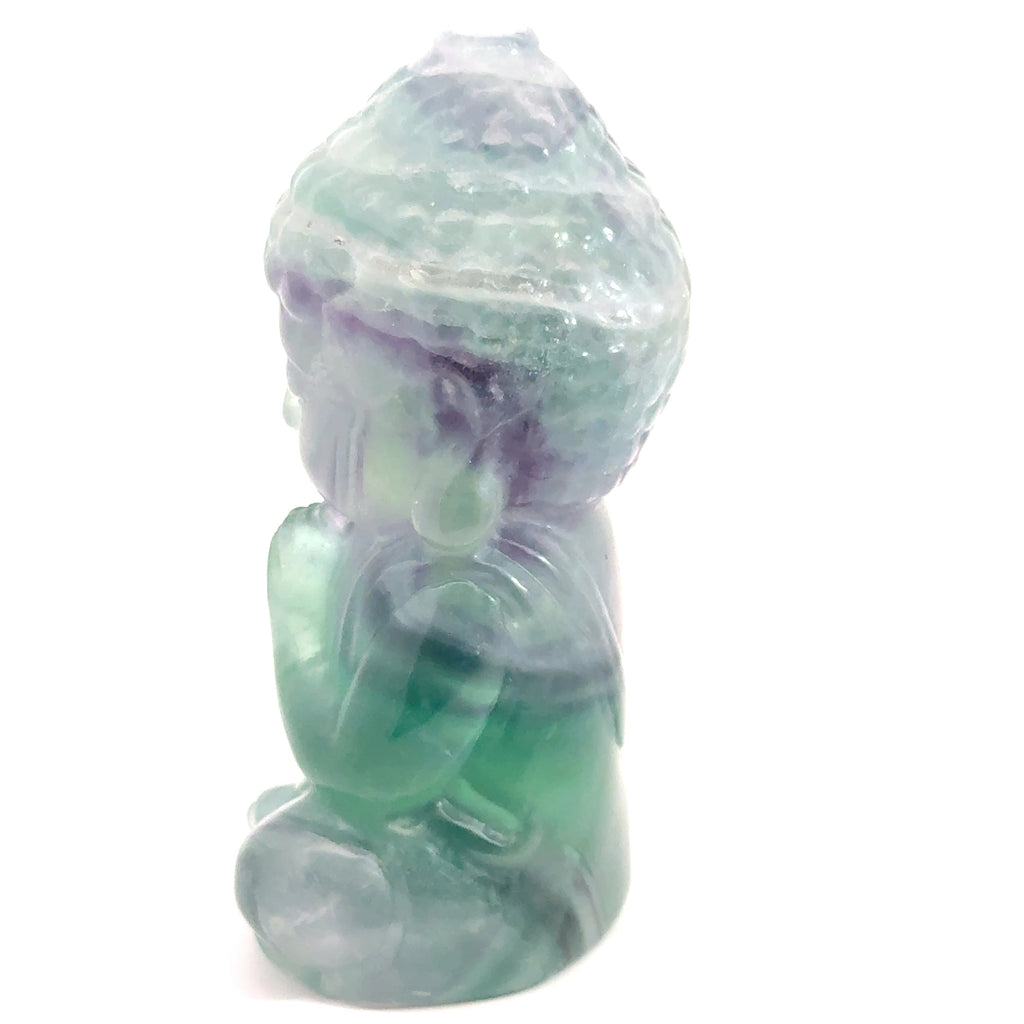 Rainbow Fluorite Buddha Carving on white 594.9g left side view 