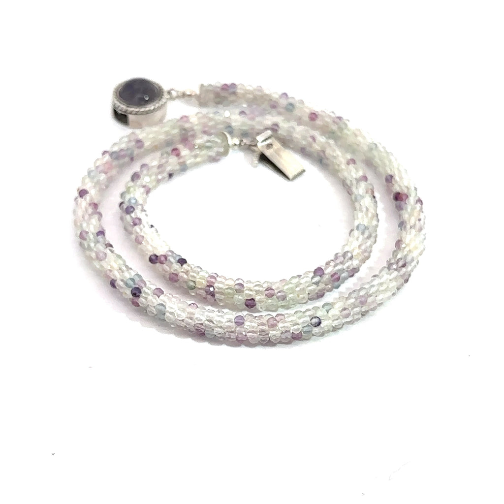 Rainbow Fluorite Gemstone Necklace on white spiral top overview