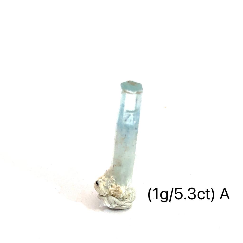 Raw Aquamarine with Schorl Gemstone 1g A  on white close up overview