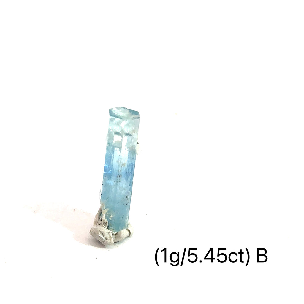 Raw Aquamarine with Schorl Gemstone 1g B  on white close up overview