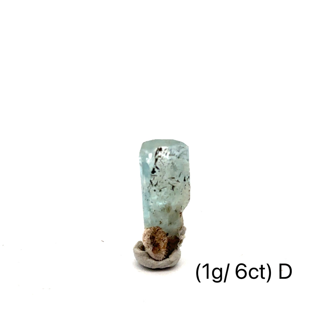 Raw Aquamarine with Schorl Gemstone 1g D  on white close up overview